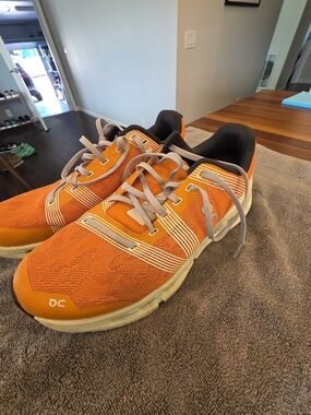 On Running Black and Orange Running Shoe (Men's)